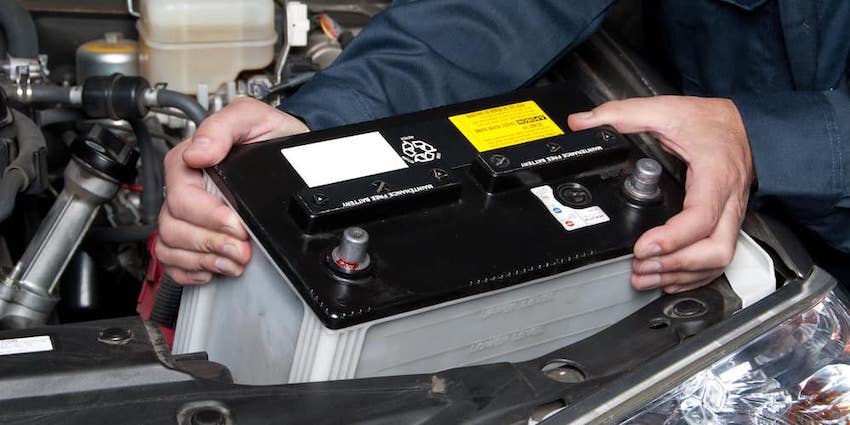 Mechanic Removing Car Battry 7452786 xl 2015